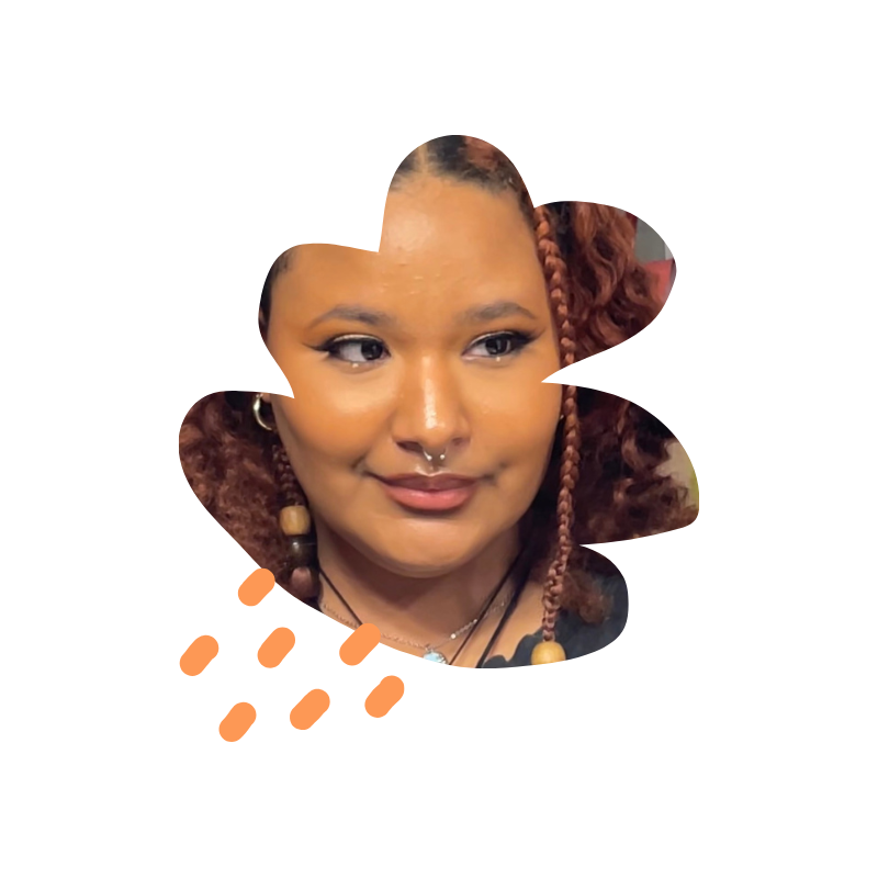 Flower-shaped cutout of Vanessa, a lightskinned black femme person.